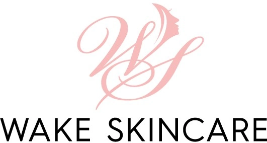 The image is a logo for "Wake Skincare," featuring stylized, intertwined letters "WS" in pink with a side profile of a woman's face incorporated into the design. Reminiscent of the premium Skin Care Wake County offers, the brand name "Wake Skincare" is written in black capital letters below.